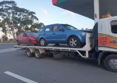 Tow truck towing two cars Perth Towing and Tow Truck Services