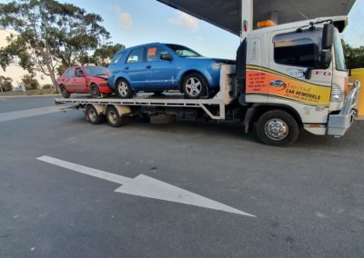 Tow truck towing two cars. Perth Towing and Tow Truck Services