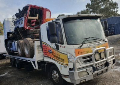 Tow truck towing a tractor. Perth Towing and Tow Truck Services
